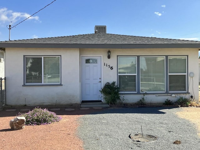 view of front of property with cooling unit