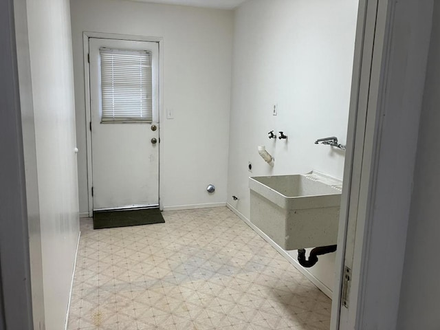 washroom with sink and hookup for an electric dryer