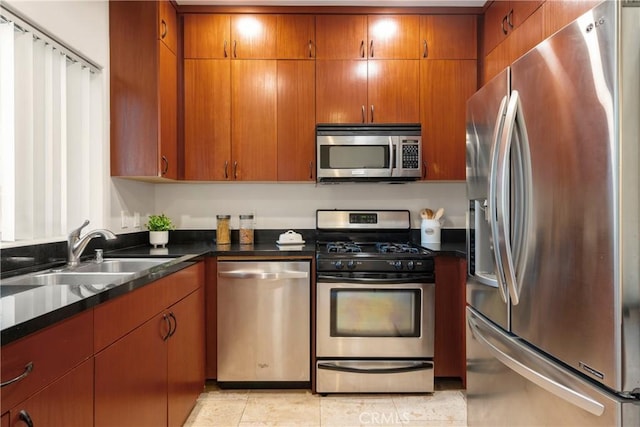 kitchen featuring light tile patterned floors, sink, and appliances with stainless steel finishes