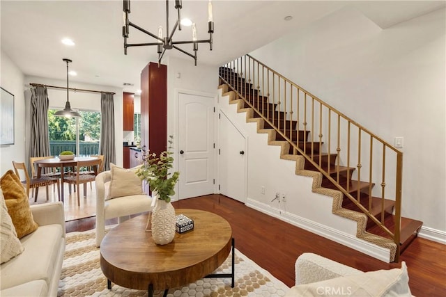 living room featuring a chandelier and hardwood / wood-style floors