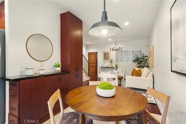 dining space featuring a notable chandelier