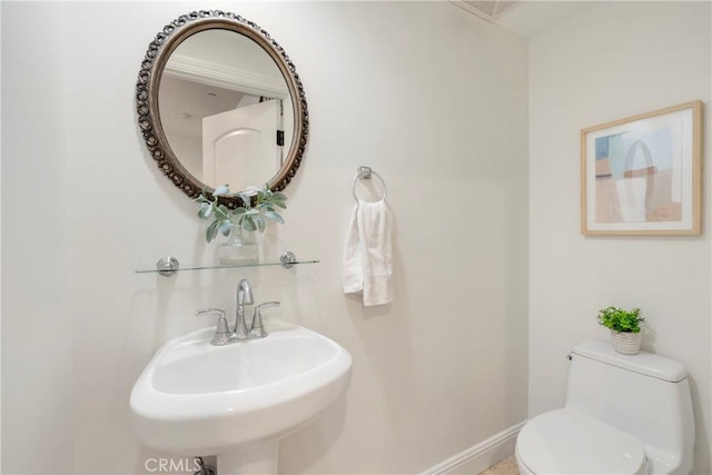 bathroom with toilet and sink