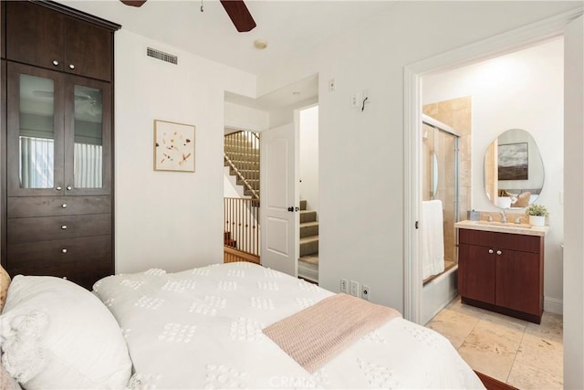 bedroom featuring ensuite bathroom, ceiling fan, and sink