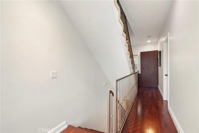 corridor with dark hardwood / wood-style floors