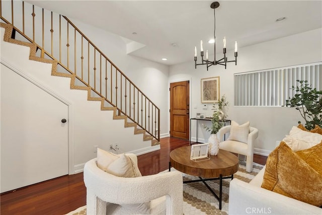 living room featuring a notable chandelier and wood-type flooring