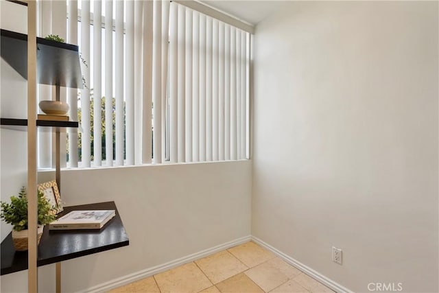 spare room with light tile patterned floors