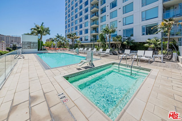 view of swimming pool with a patio