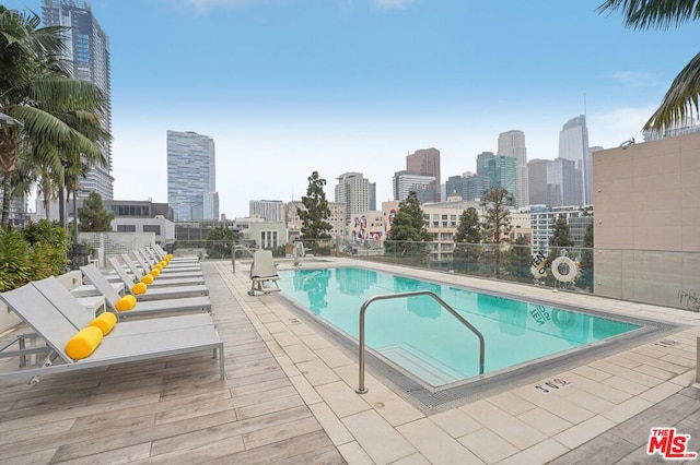 view of swimming pool featuring a patio