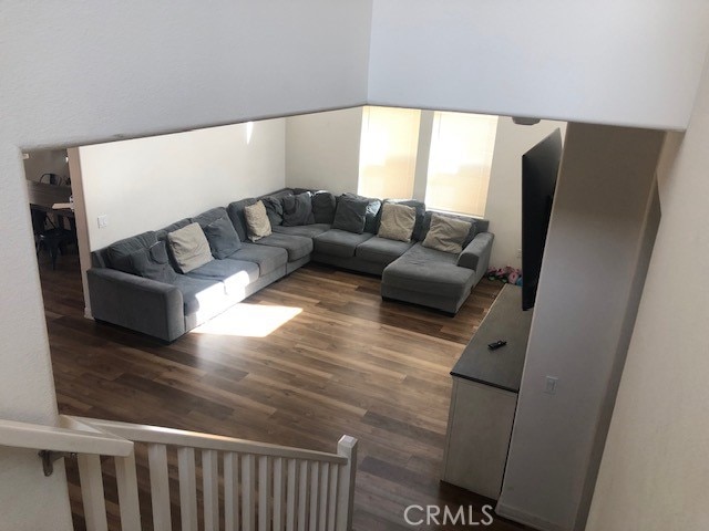 living room with dark hardwood / wood-style flooring