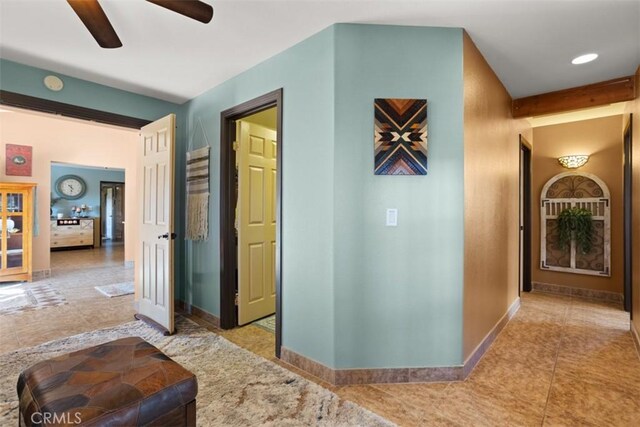 hallway with tile patterned flooring