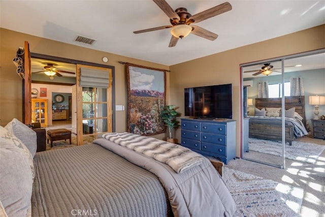 carpeted bedroom featuring ceiling fan and access to exterior