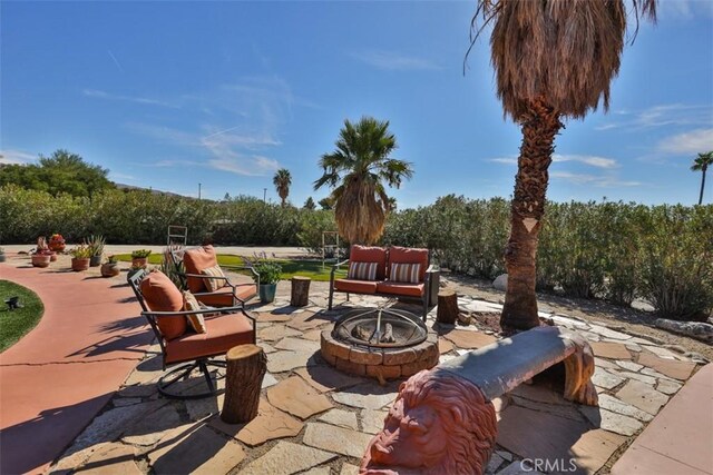 view of patio featuring an outdoor fire pit