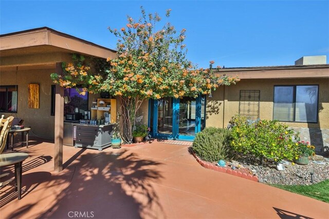 rear view of house with a patio