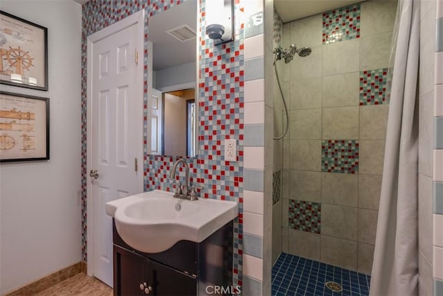 bathroom with vanity, tile patterned flooring, and curtained shower