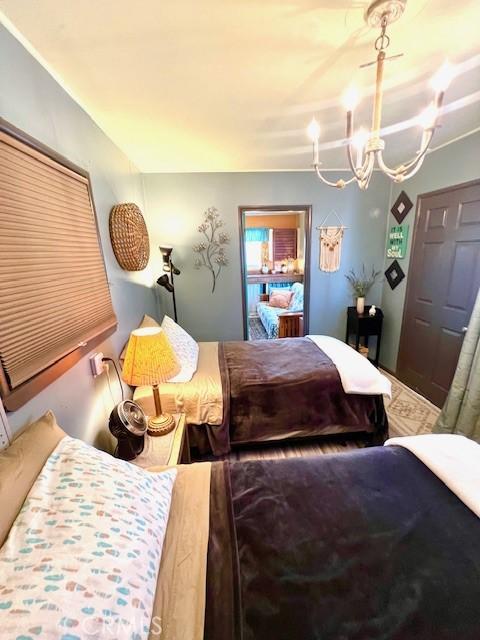 bedroom featuring an inviting chandelier