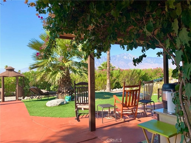 view of patio featuring a mountain view