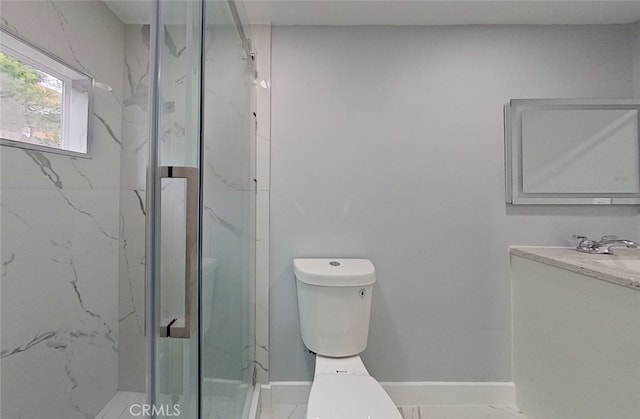 bathroom with an enclosed shower, vanity, toilet, and tile patterned flooring