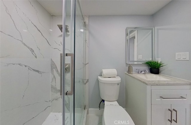 bathroom featuring walk in shower, vanity, and toilet