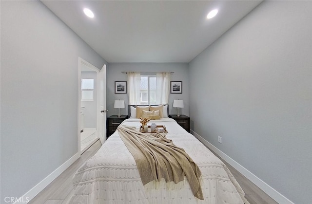 bedroom with light hardwood / wood-style flooring