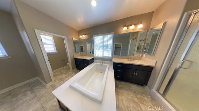 full bathroom with vanity, toilet, plus walk in shower, and a wealth of natural light