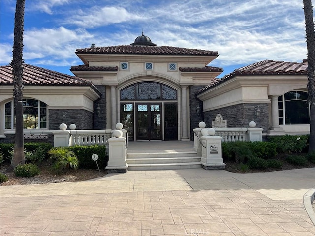 doorway to property with french doors