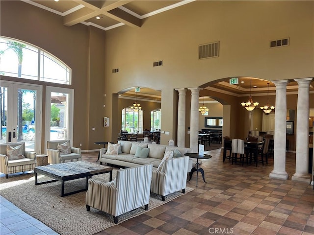 living room with a high ceiling, coffered ceiling, crown molding, beamed ceiling, and a notable chandelier