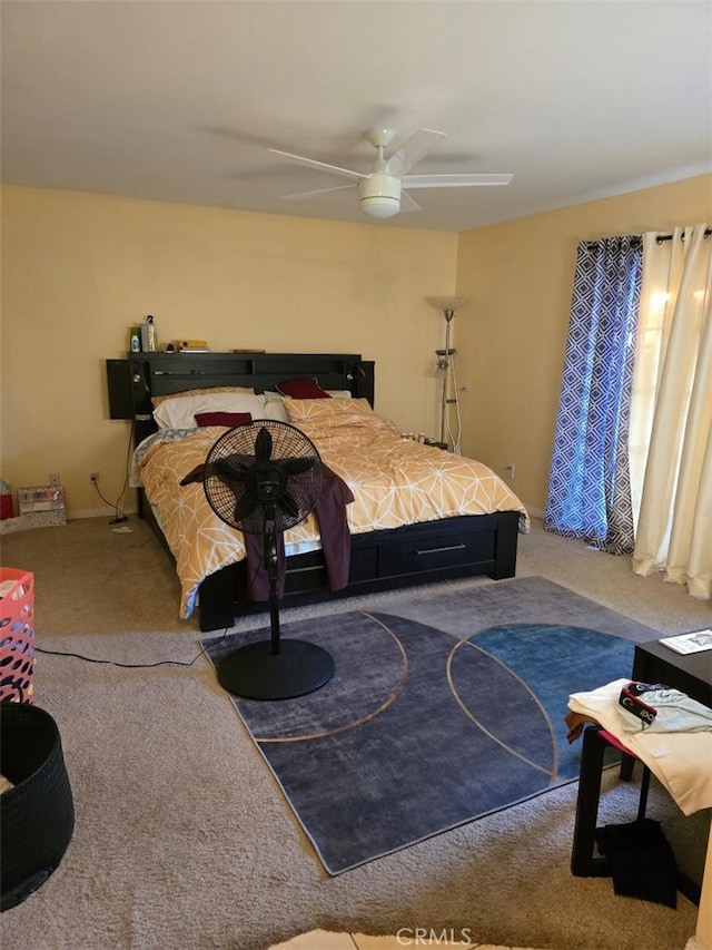 carpeted bedroom with ceiling fan