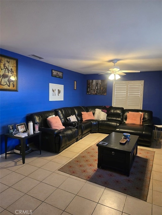 tiled living room featuring ceiling fan