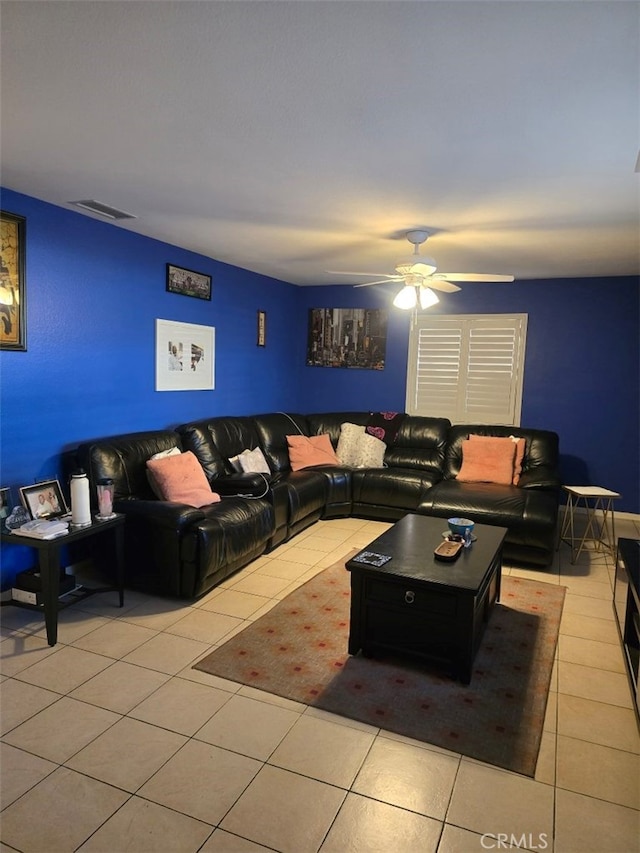 tiled living room featuring ceiling fan