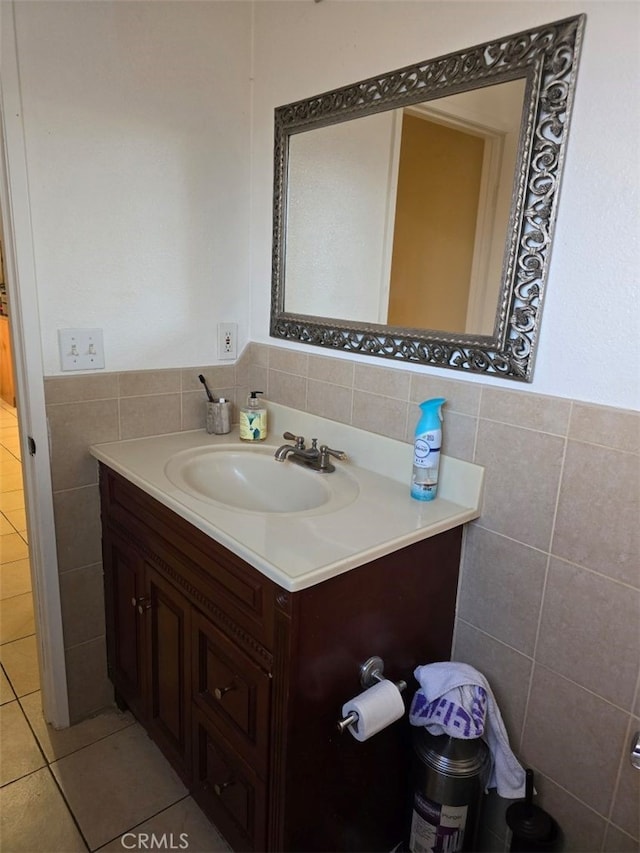 bathroom with tile patterned floors, vanity, and tile walls