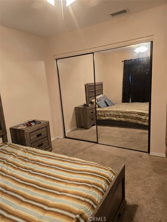 carpeted bedroom with a closet