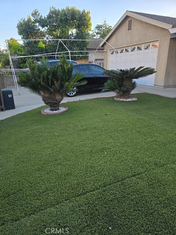 view of yard with a garage