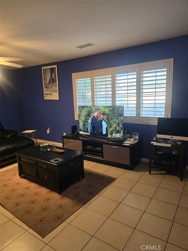 tiled home office with ceiling fan