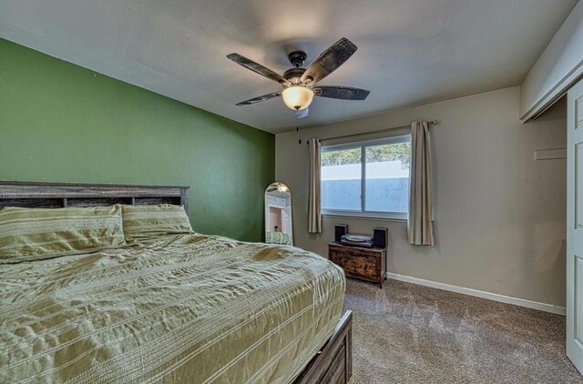 carpeted bedroom with ceiling fan