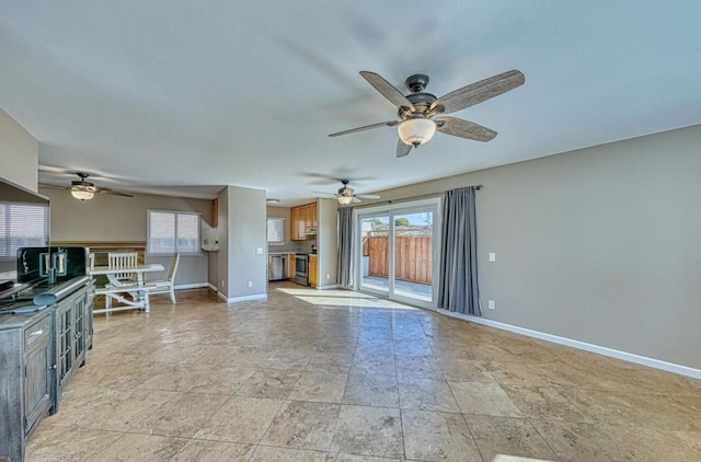 unfurnished living room featuring ceiling fan