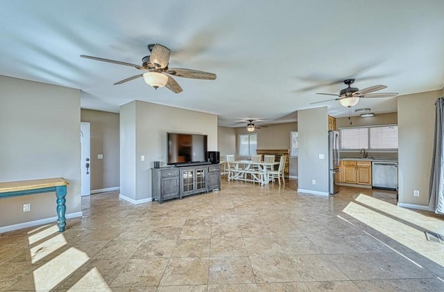 unfurnished living room featuring ceiling fan