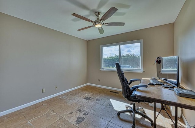 unfurnished office featuring ceiling fan