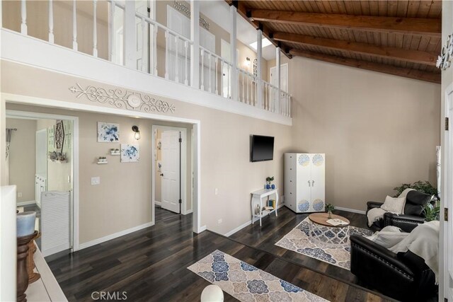 living room with dark wood-type flooring, high vaulted ceiling, beamed ceiling, and wooden ceiling