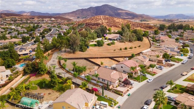 birds eye view of property featuring a mountain view