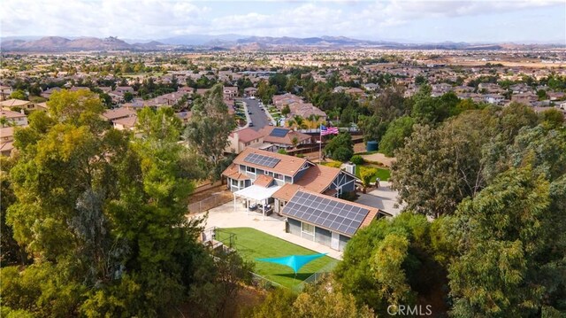 birds eye view of property with a mountain view