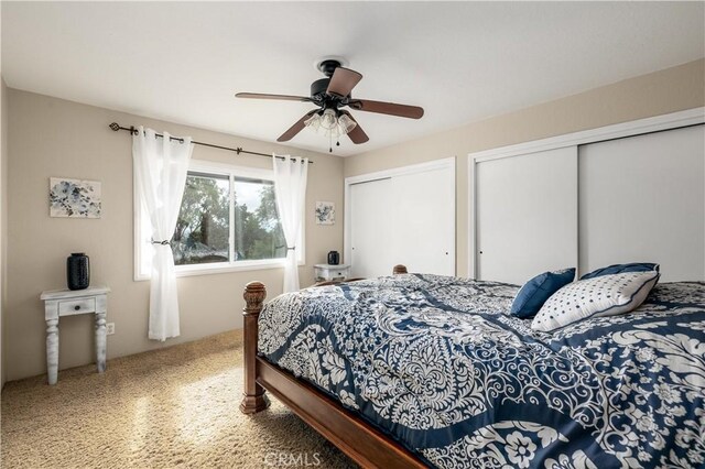 bedroom featuring two closets and ceiling fan