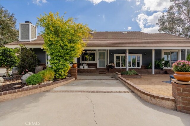 back of property featuring a patio area