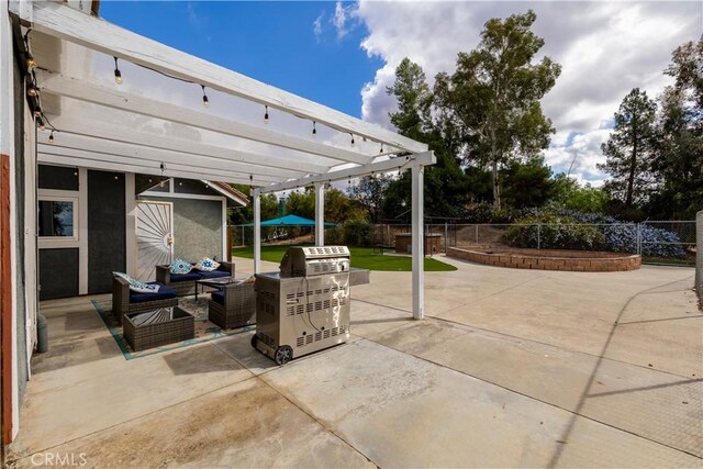 view of patio featuring a pergola, a storage unit, and an outdoor hangout area