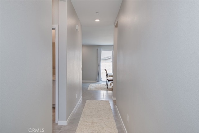 corridor with light tile patterned flooring