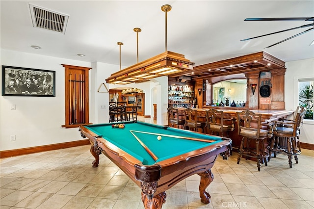 playroom featuring pool table, bar area, and light tile patterned floors