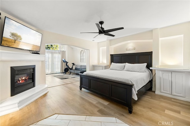 bedroom featuring light hardwood / wood-style floors and ceiling fan