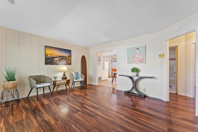 sitting room featuring dark hardwood / wood-style floors