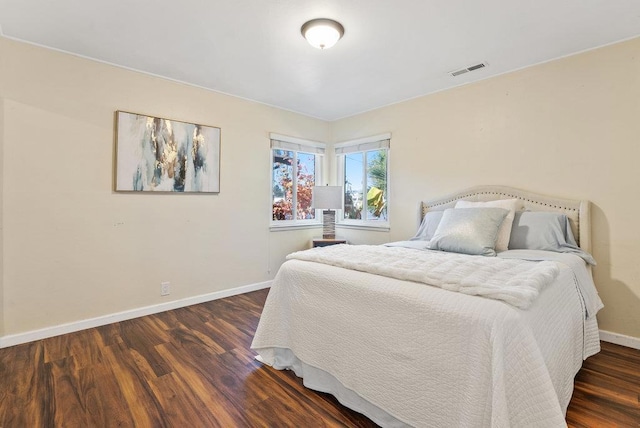 bedroom featuring dark hardwood / wood-style flooring