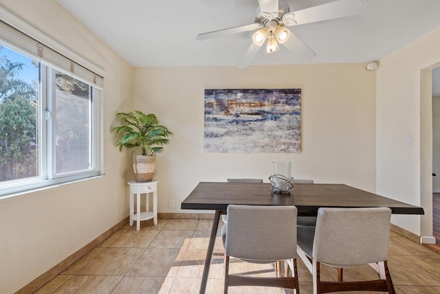 dining area with ceiling fan, a healthy amount of sunlight, and light tile patterned flooring