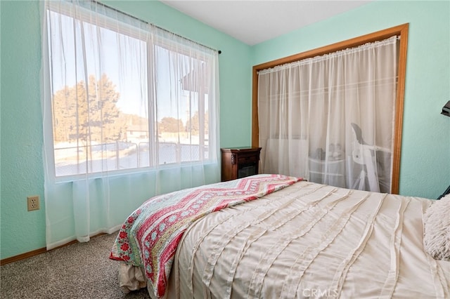 bedroom featuring carpet floors and multiple windows